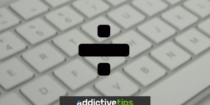 Divide symbol with white keyboard in the background